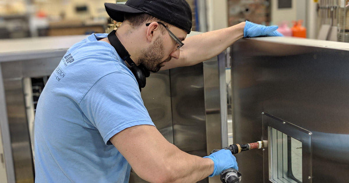 Technician assembling a test chamber